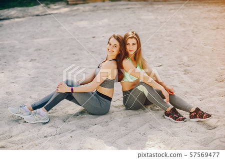 Two girls on a beach 57569477