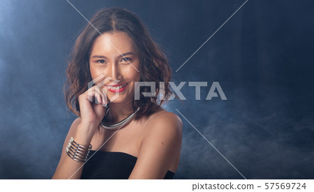 Fashion Asian Woman Tan skin black hair eyes Fashion Asian Woman Tan skin black hair eyes 57569724