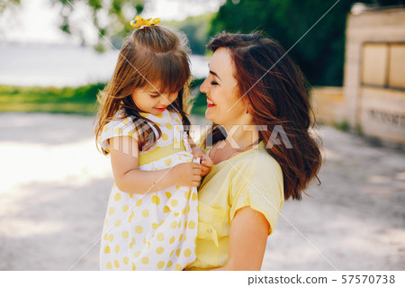 mother with daughter in a solar park 57570738