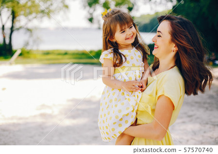 mother with daughter in a solar park 57570740