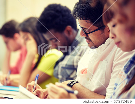 group of international students writing at lecture group of international students writing at lecture 57572499