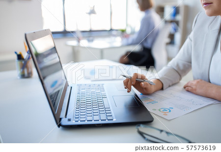 businesswoman with laptop working at office 57573619