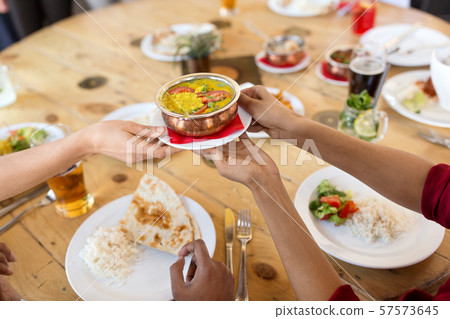 international friends eating at restaurant 57573645