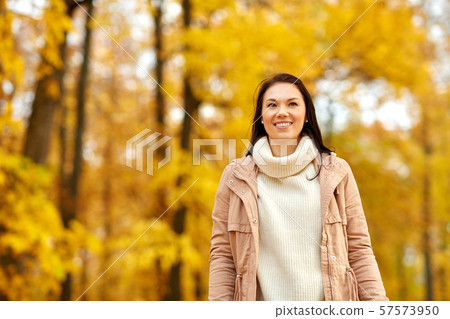 beautiful happy young woman smiling in autumn park beautiful happy young woman smiling in autumn park 57573950