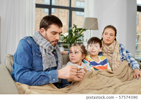 family with ill children having fever at home family with ill children having fever at home 57574390