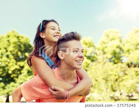 happy teenage couple having fun at summer park happy teenage couple having fun at summer park 57575248