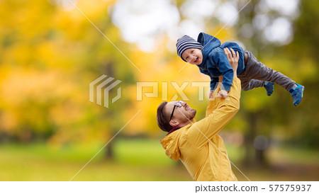 father with son playing and having fun in autumn father with son playing and having fun in autumn 57575937