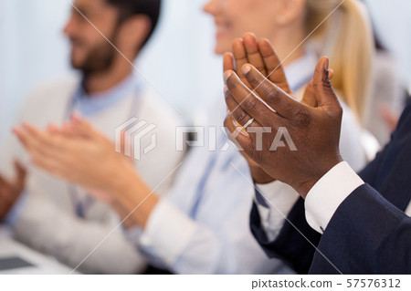 happy people applauding at business conference happy people applauding at business conference 57576312