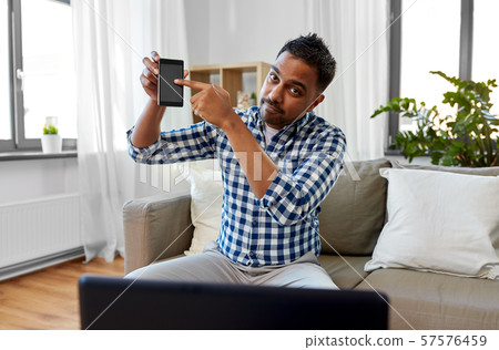 male blogger with smartphone videoblogging 57576459