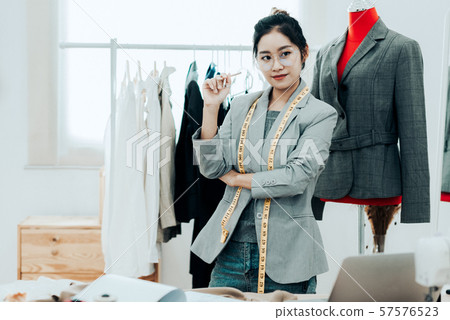 Asian young women fashion designer working Asian young women fashion designer working 57576523