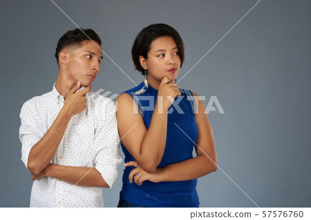 Young couple in thinking pose 57576760