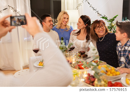 family having dinner party and taking selfie family having dinner party and taking selfie 57576915