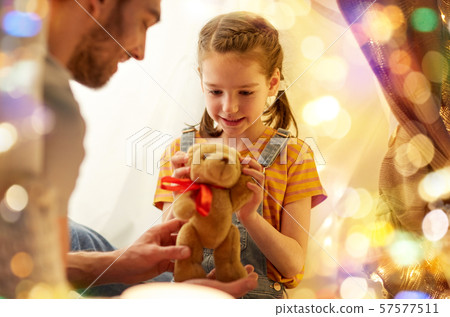 happy family playing with toy in kids tent at home 57577511