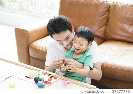 Parent and child playing with clay Parent and child playing with clay 57577770