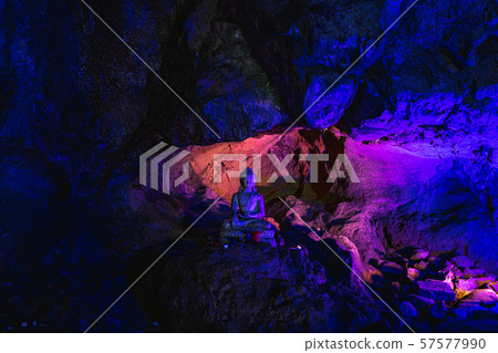 Buddha statue in cave Buddha statue in cave 57577990