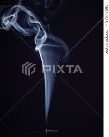Burning incense with white smoke, isolated on 57578680
