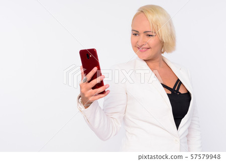 Portrait of happy beautiful blonde businesswoman using phone Portrait of happy beautiful blonde businesswoman using phone 57579948