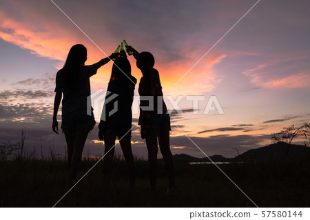 Group of young asian women cheering, drinking alcohol, having fun on weekend. Group of young asian women cheering, drinking alcohol, having fun on weekend. 57580144