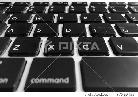Dirty unclean black computer keyboard with white hair and dust close up detail keyboard buttons 57580455