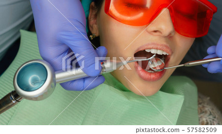 Girl patient in dental clinic Girl patient in dental clinic 57582509