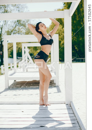 Sunny girl on a beach Sunny girl on a beach 57582645