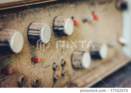 The old amplifiers damaged, placed on the table until the dust was captured. 57582678