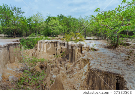 Beautiful Scenery of Water flows through the ground have erosion and collapse of the soil  into a  natural layer at Pong Yub,  Ratchaburi,Thailand Beautiful Scenery of Water flows through the ground have erosion and collapse of the soil  into a  natural layer at Pong Yub,  Ratchaburi,Thailand 57583568