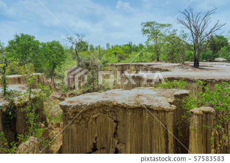 Beautiful Scenery of Water flows through the ground have erosion and collapse of the soil  into a  natural layer at Pong Yub,  Ratchaburi,Thailand Beautiful Scenery of Water flows through the ground have erosion and collapse of the soil  into a  natural layer at Pong Yub,  Ratchaburi,Thailand 57583583