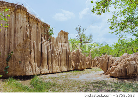Beautiful Scenery of Water flows through the ground have erosion and collapse of the soil  into a  natural layer at Pong Yub,  Ratchaburi,Thailand Beautiful Scenery of Water flows through the ground have erosion and collapse of the soil  into a  natural layer at Pong Yub,  Ratchaburi,Thailand 57583588