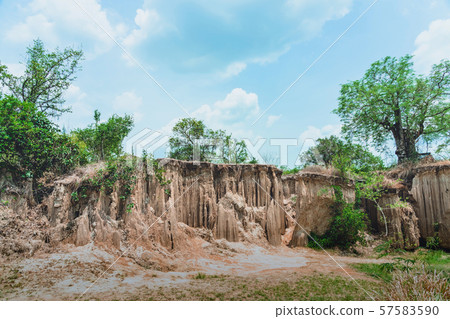 Beautiful Scenery of Water flows through the ground have erosion and collapse of the soil  into a  natural layer at Pong Yub,  Ratchaburi,Thailand Beautiful Scenery of Water flows through the ground have erosion and collapse of the soil  into a  natural layer at Pong Yub,  Ratchaburi,Thailand 57583590