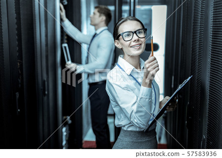 Smiling lady with a notebook feeling excited 57583936