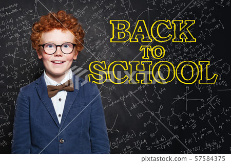 Laughing child on chalkboard background. Laughing child on chalkboard background. 57584375