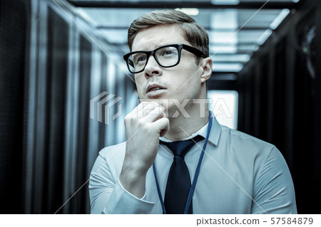 Serious investigator in eyeglasses thinking about the problem solution Serious investigator in eyeglasses thinking about the problem solution 57584879