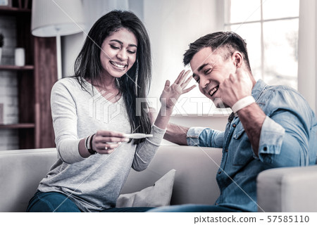 Appealing couple being extremely happy with news 57585110