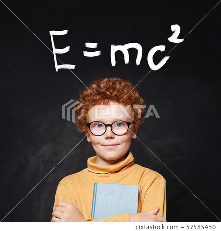 Happy young boy genius and science formula against Happy young boy genius and science formula against 57585430