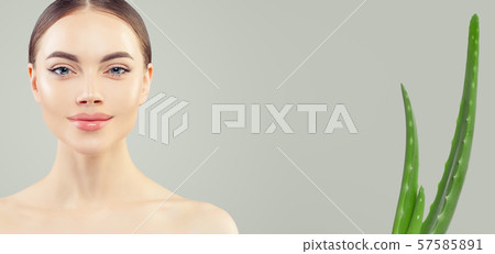 Perfect woman face and and green aloe plant 57585891