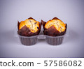 Two muffins in plastic packaging 57586082