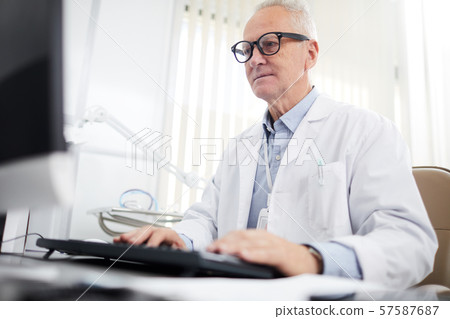 Senior Doctor Using Computer Senior Doctor Using Computer 57587687