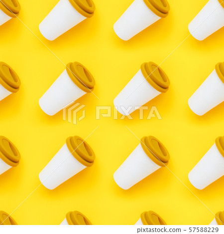 White bamboo coffee to go cup with a yellow rubber lid on a yellow background White bamboo coffee to go cup with a yellow rubber lid on a yellow background 57588229