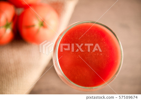 tomato juice in the glass put on the table tomato juice in the glass put on the table 57589674