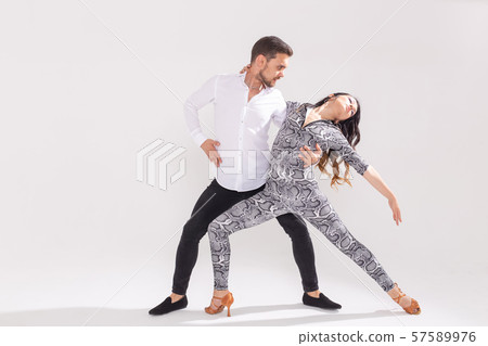 Passionate couple dancing social danse kizomba or bachata or semba or taraxia on white background 57589976