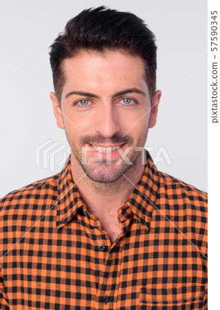 Face of happy handsome bearded hipster man smiling 57590345