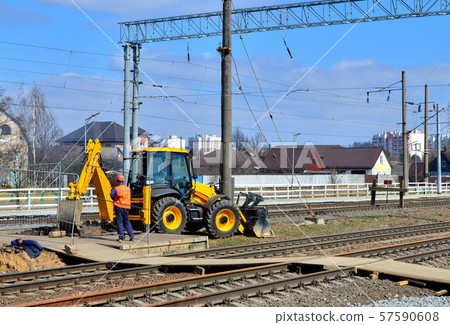 Yellow bulldozer carries out excavation work 57590608