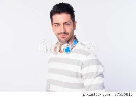 Face of handsome bearded man with headphones 57590916
