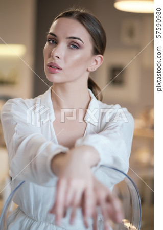 Amazing Blue eyed blond woman smiling to camera. 57590980