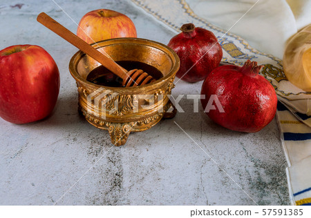 Honey, apple and pomegranate traditional holiday 57591385