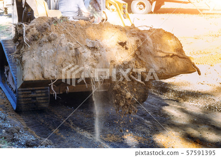 Close up of bulldozer scoop moving earth 57591395