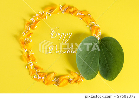 Happy Dussehra. Yellow flowers, green leaf Happy Dussehra. Yellow flowers, green leaf 57592372