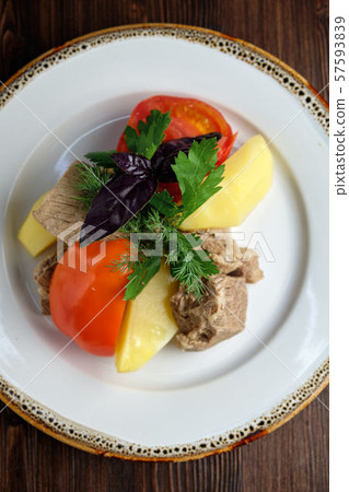 Boiled meat with a side dish and vegetables . restaurant menu Boiled meat with a side dish and vegetables . restaurant menu 57593839
