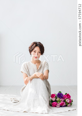 Bouquet and woman beauty (vertical composition) 57594712
